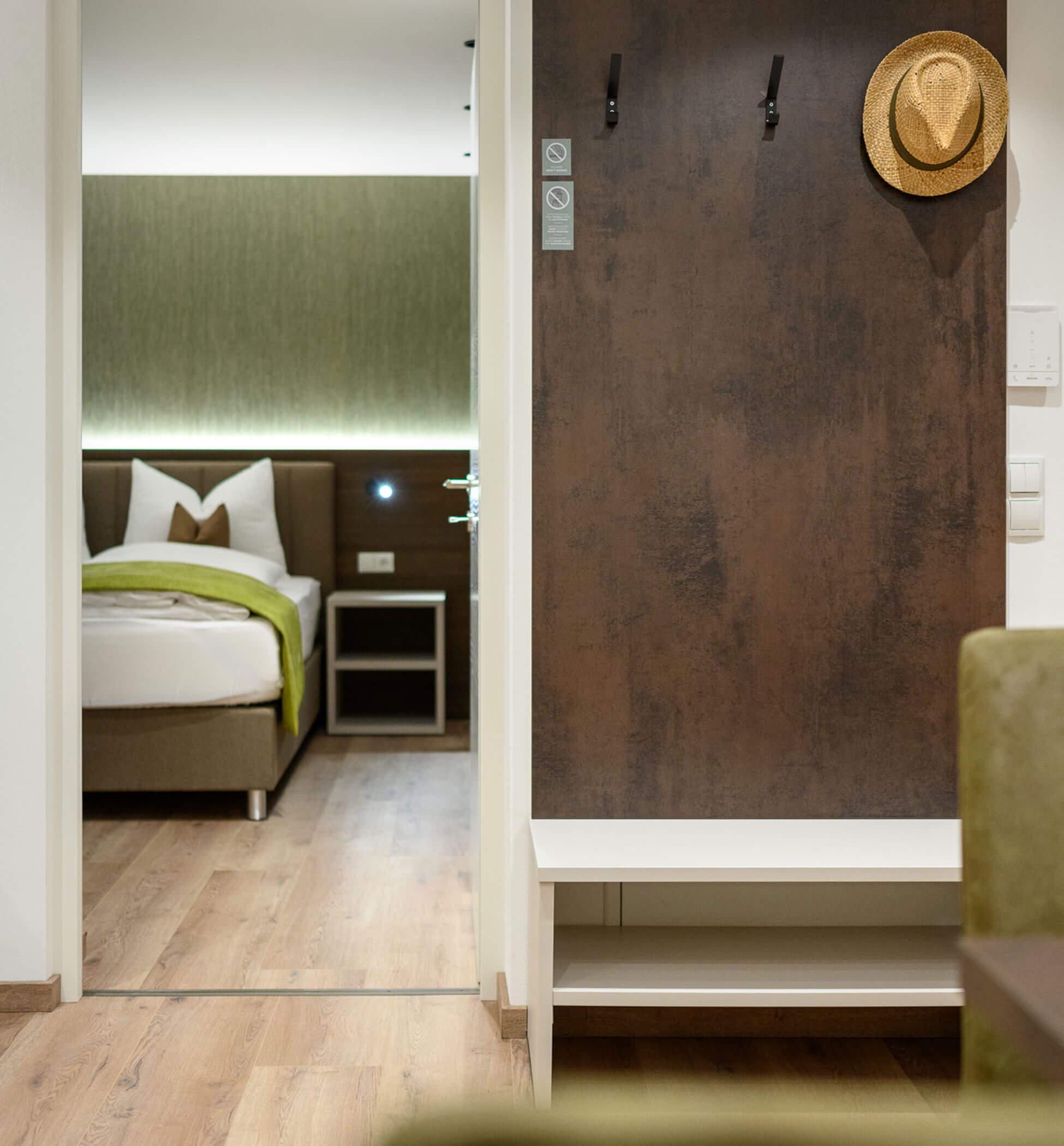 Wardrobe and view into the bedroom of apartment Moos