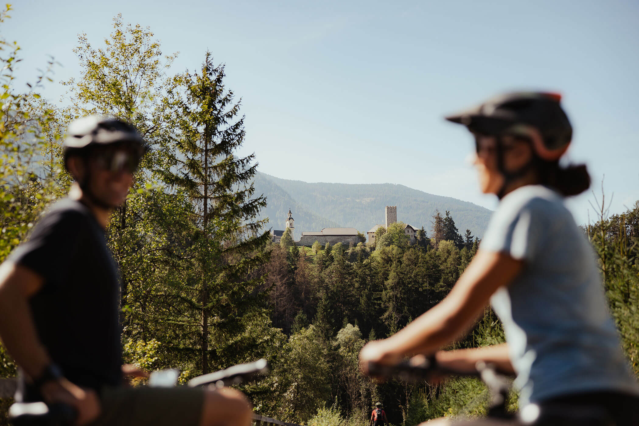 Two cyclists in the forest