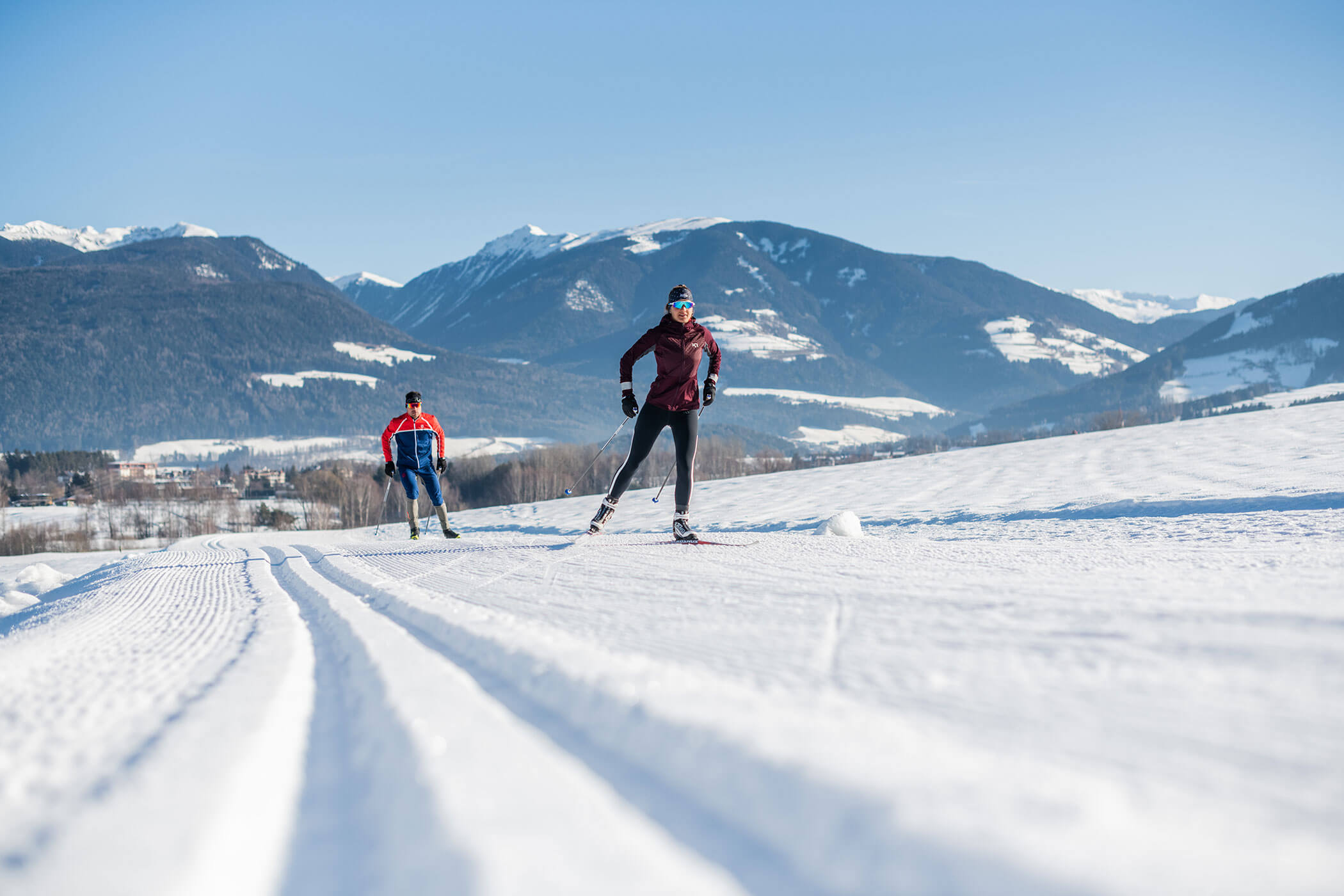 Two cross-country skiers on the trail