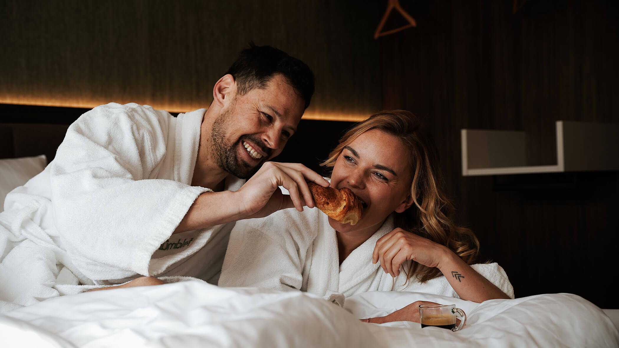 A couple having breakfast in bed