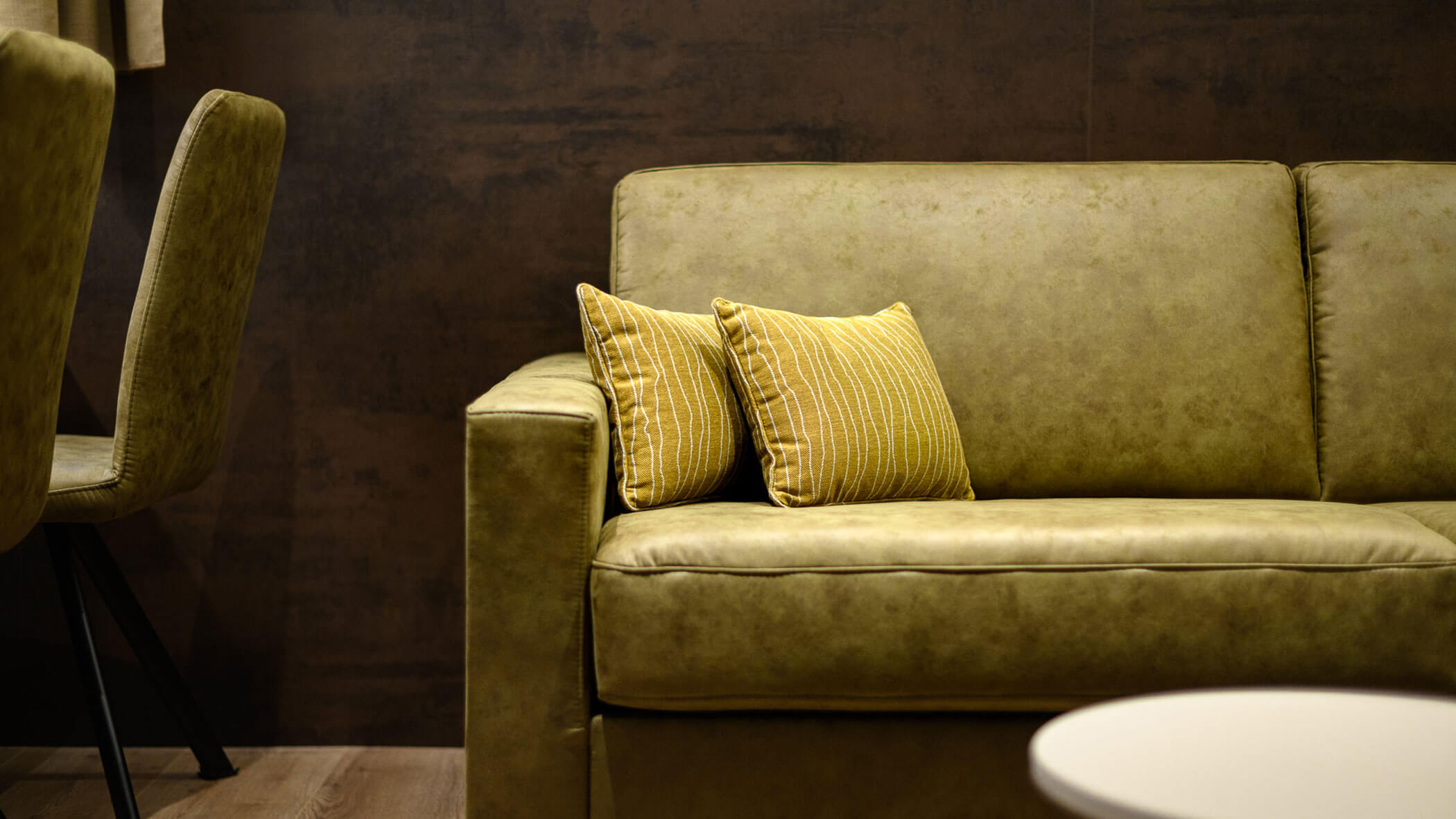 Green sofa with two cushions